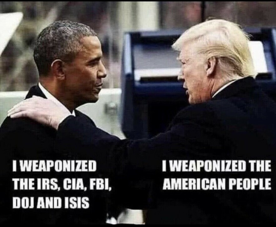 Two men dressed in formal suits engage in conversation, with one placing a hand on the other's shoulder. The man on the left is accompanied by the text, "I weaponized the IRS, CIA, FBI, DOJ and ISIS," while the man on the right has the text, "I weaponized the American people."