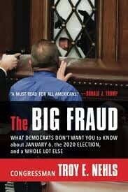 Cover of the book titled "The Big Fraud" by Congressman Troy E. Nehls, featuring an image of a person in a blue shirt standing in front of a window with hands raised, with a single quote: "A MUST READ FOR ALL AMERICANS" attributed to Donald J. Trump. The subtitle reads, "What Democrats don't want you to know about January 6, the 2020 election, and a whole lot else".