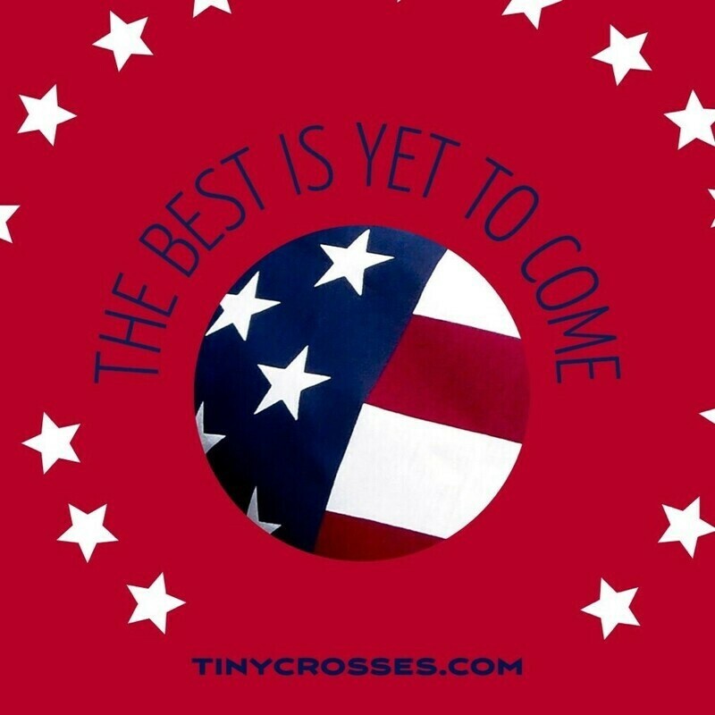 Red background with white stars surrounding a circular image of the American flag. Text above the flag reads "THE BEST IS YET TO COME" and "TINYCROSSES.COM" is printed below.