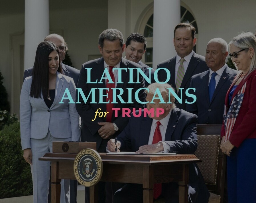 President Trump signs a document at a desk surrounded by a diverse group of Latino Americans, with a banner reading "Latino Americans for Trump" superimposed over the image. The seal of the President of the United States is visible on the front of the desk.