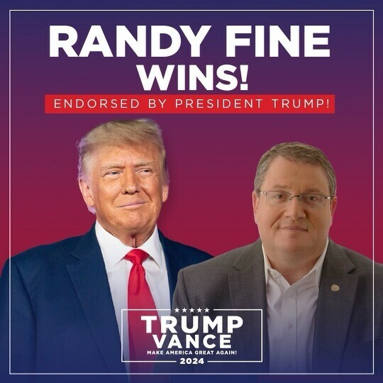 "Randy Fine Wins! Endorsed by President Trump! Trump Vance 2024 Make America Great Again!" Text overlaid on an image of two people in suits, one wearing a red tie and the other wearing glasses. The background features a gradient from purple to red.