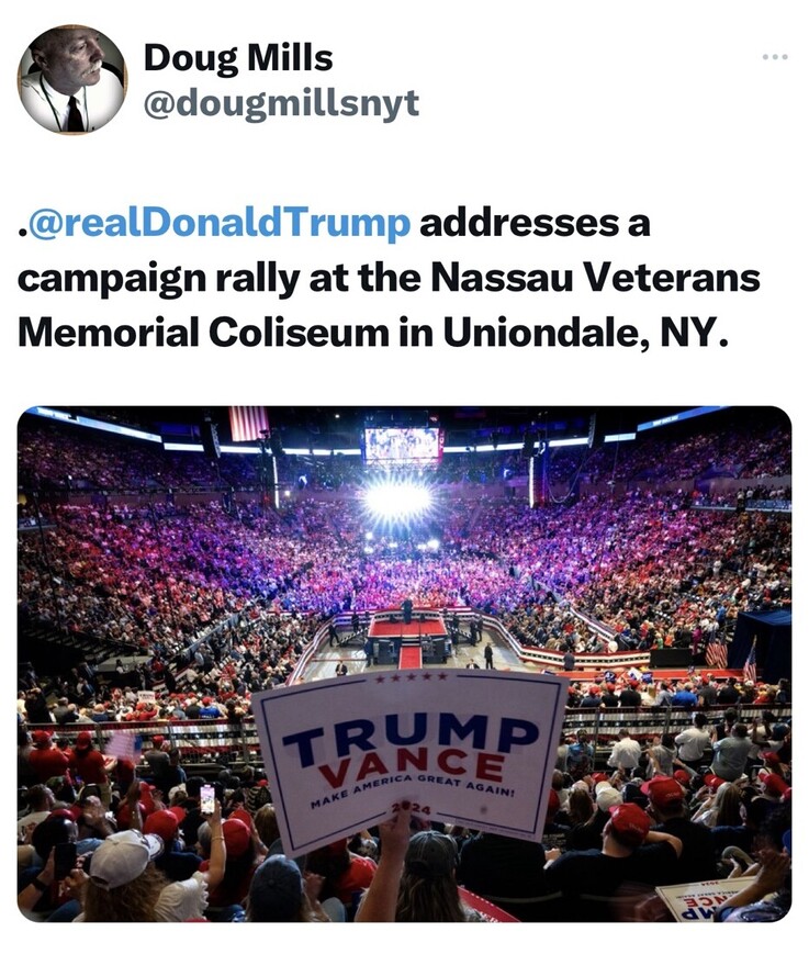 .@realDonaldTrump addresses a campaign rally at the Nassau Veterans Memorial Coliseum in Uniondale, NY. The image shows a large crowd inside the Coliseum, with flags and banners, some of which say "Trump Vance Make America Great Again 2024." A stage is set up with bright lights where the address is taking place.