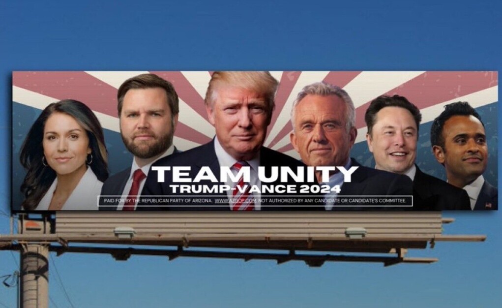 Billboard promoting "Team Unity Trump-Vance 2024" featuring headshots of six individuals, including a central figure with blonde hair and a suit, with background graphics of red and white rays emanating from the center. Text at the bottom states it is paid for by the Republican Party of Arizona.