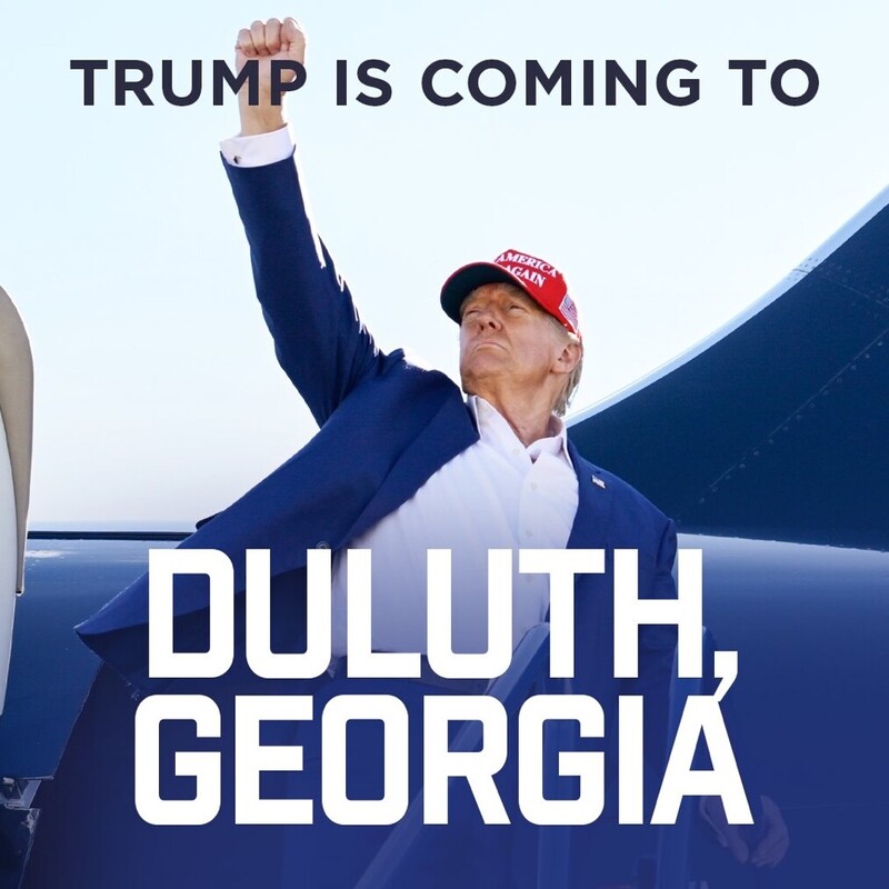 Person wearing a red "Make America Great Again" cap and a blue suit, raising a fist in the air beside the text "Trump is Coming to Duluth, Georgia" on a blue background.