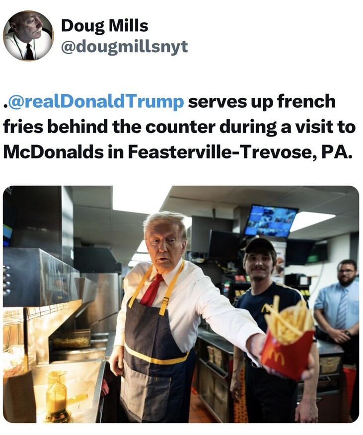 Donald Trump serves french fries behind the counter at a McDonald's in Feasterville-Trevose, Pennsylvania, wearing an apron and tie, accompanied by staff members.