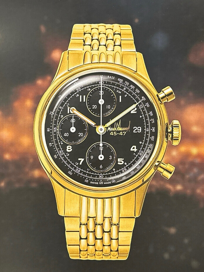 Gold wristwatch with a black dial featuring multiple subdials, chronograph functions, and a date display. Elegant design with a stainless steel bracelet and classic watch hands against a blurred background.