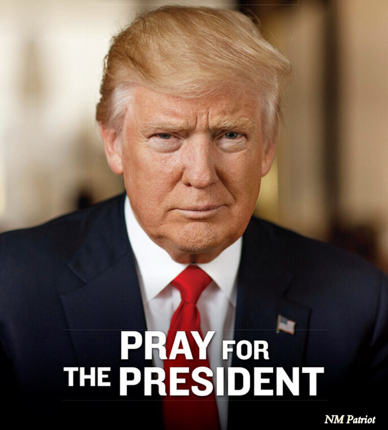 A man in formal attire with a serious expression, wearing a dark suit, white shirt, and red tie. The text "Pray for the President" is overlaid on the image.